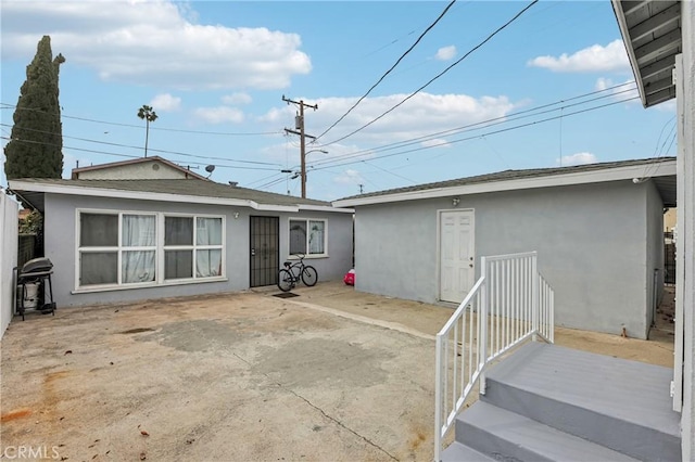 back of house with a patio area