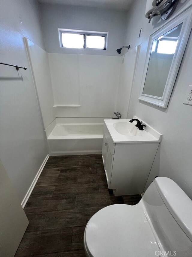 full bathroom with shower / tub combination, toilet, vanity, and wood-type flooring