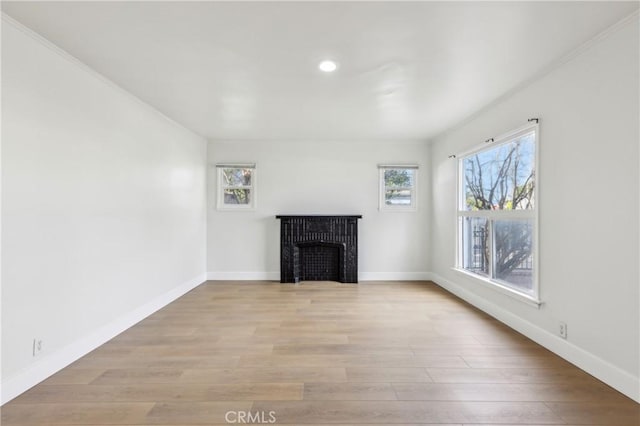 unfurnished living room with light wood-type flooring