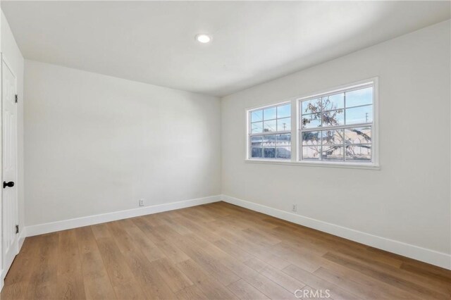 empty room with light wood-type flooring