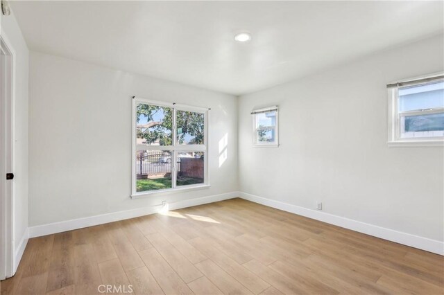 spare room with light hardwood / wood-style floors