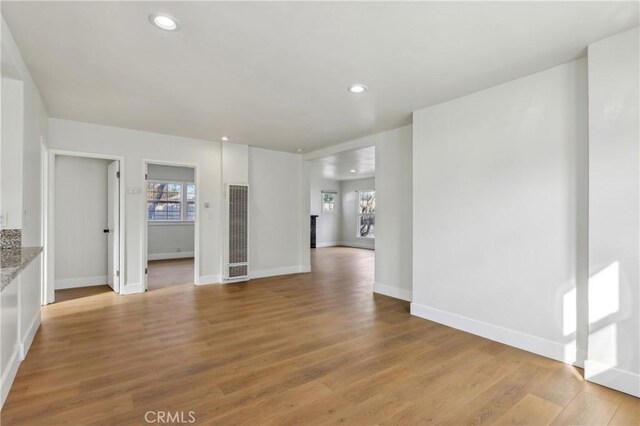 unfurnished living room featuring light hardwood / wood-style flooring