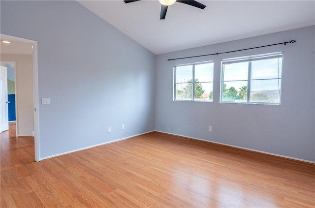 spare room featuring lofted ceiling, ceiling fan, and light hardwood / wood-style floors