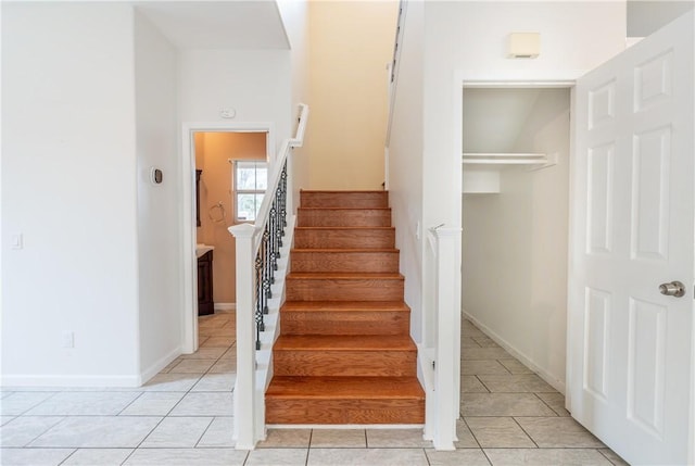 stairway featuring tile patterned floors