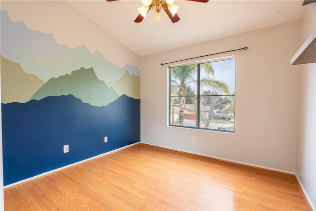 spare room featuring vaulted ceiling, ceiling fan, and light hardwood / wood-style flooring