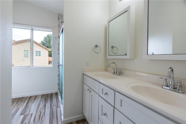 bathroom featuring vanity and hardwood / wood-style flooring