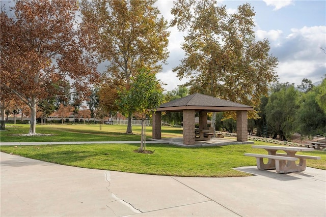 view of home's community with a gazebo and a yard