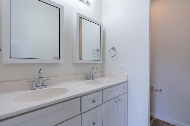 bathroom with vanity and hardwood / wood-style flooring