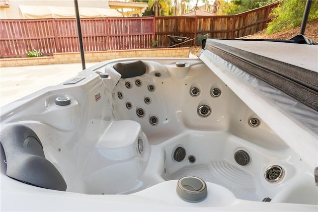 exterior details featuring a jacuzzi