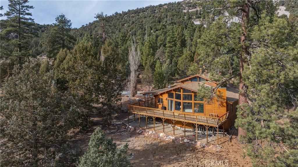 rear view of property with a wooden deck