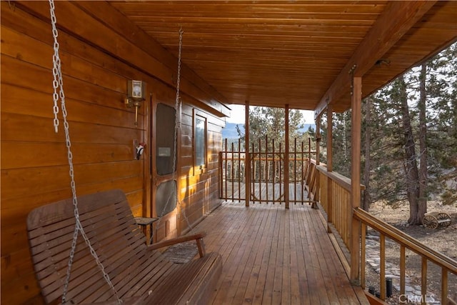 wooden terrace with a porch