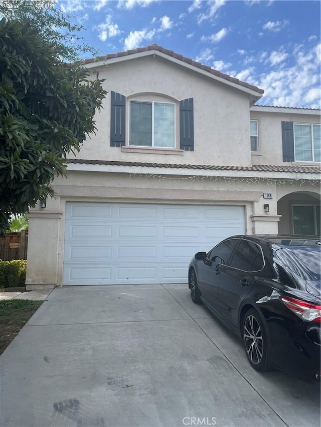 view of front of property featuring a garage