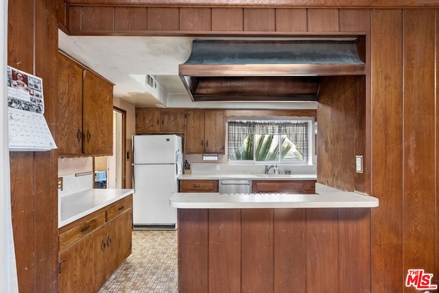 kitchen featuring white fridge, stainless steel dishwasher, and sink