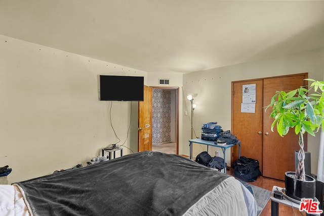 bedroom featuring hardwood / wood-style flooring