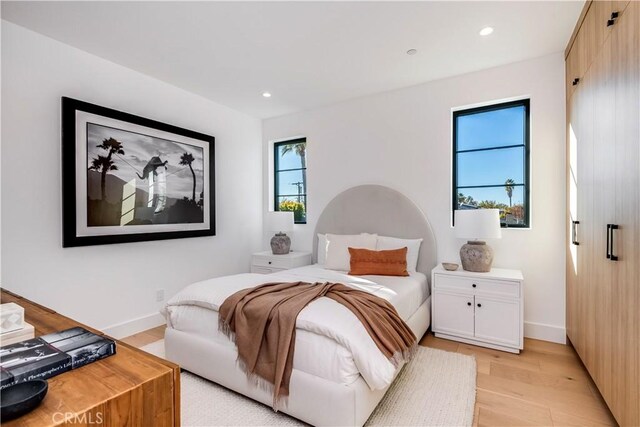 bedroom with light hardwood / wood-style floors