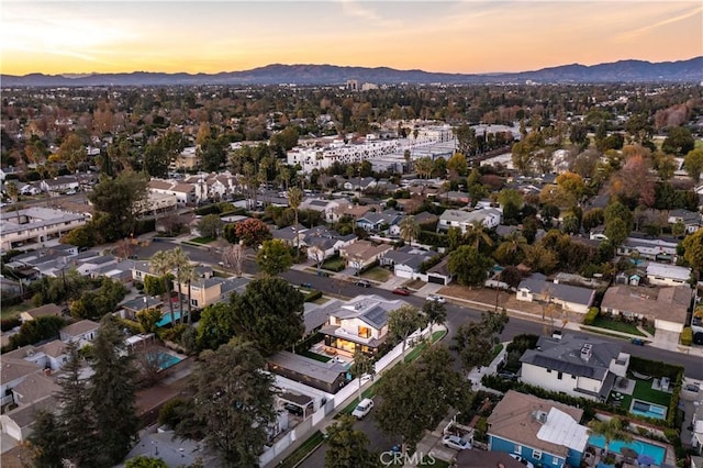 aerial view at dusk with a mountain view