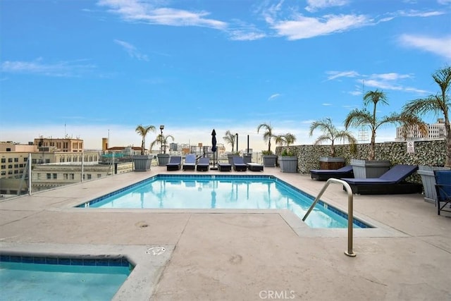 view of swimming pool featuring a patio