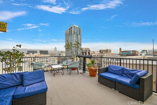 view of patio / terrace featuring outdoor lounge area and a balcony