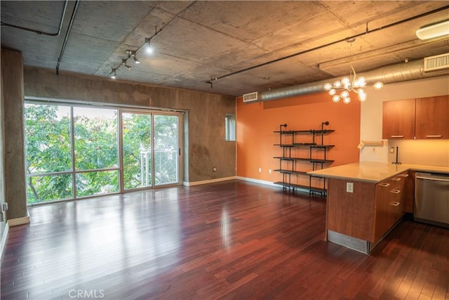 kitchen with dark hardwood / wood-style flooring, a chandelier, dishwasher, and kitchen peninsula