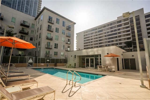 view of swimming pool with a patio area