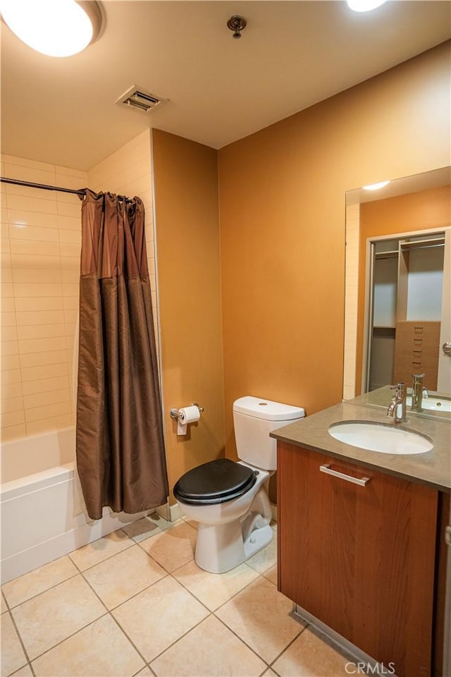 full bathroom featuring vanity, toilet, tile patterned floors, and shower / tub combo with curtain