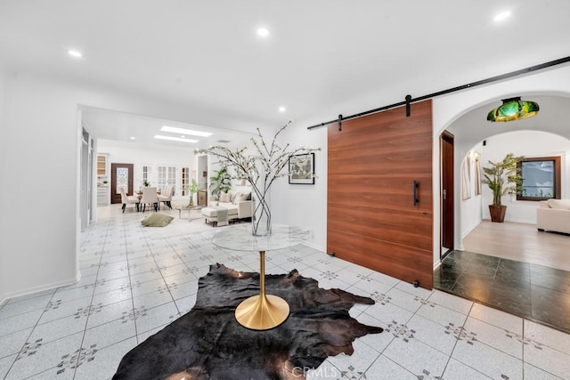 interior space featuring a barn door