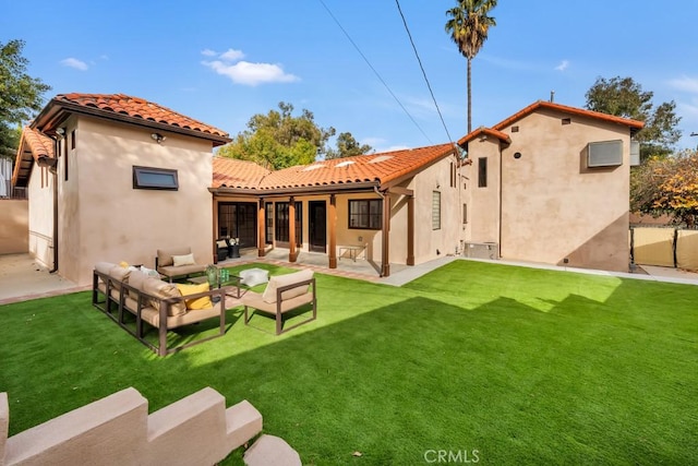 rear view of property featuring an outdoor hangout area, a yard, and a patio