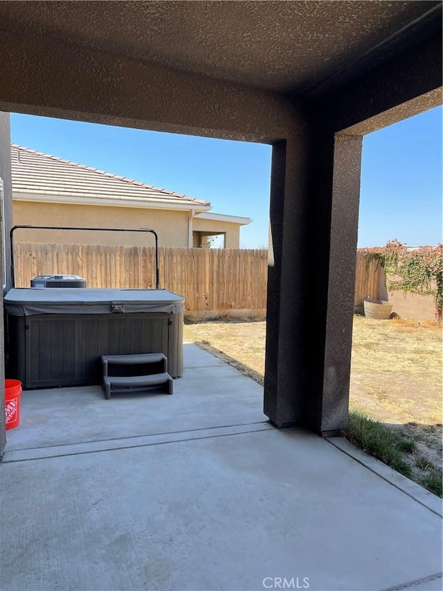 view of patio with a hot tub