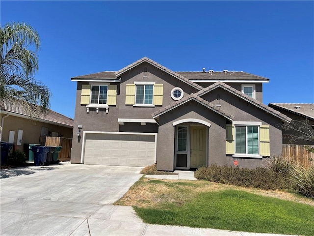 view of front of property featuring a garage and a front yard