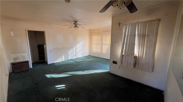 carpeted empty room with ceiling fan