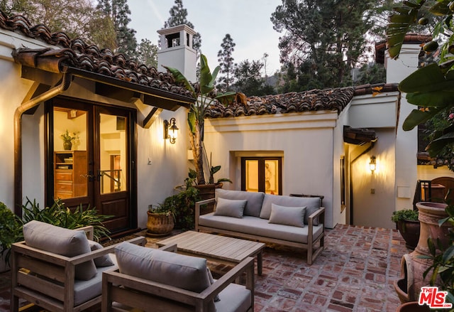 view of patio featuring outdoor lounge area and french doors