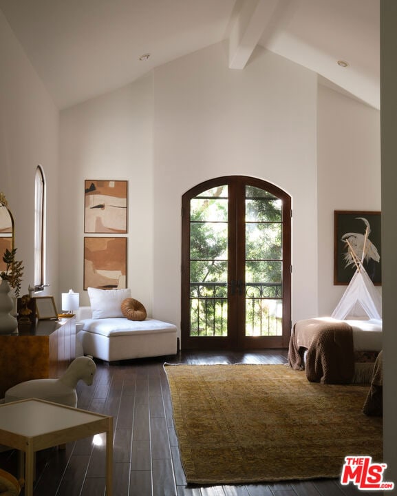 bedroom with hardwood / wood-style flooring, access to exterior, french doors, high vaulted ceiling, and beam ceiling