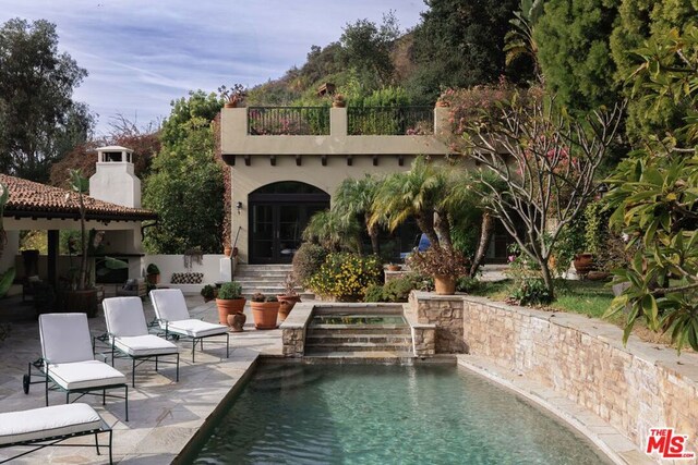 view of swimming pool with a patio