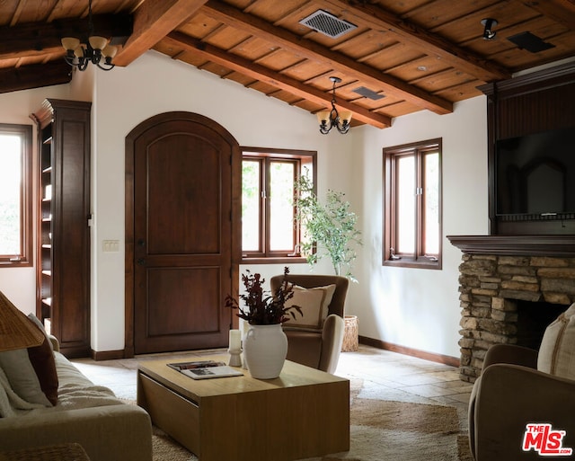 carpeted living room featuring an inviting chandelier, a fireplace, lofted ceiling with beams, and wooden ceiling