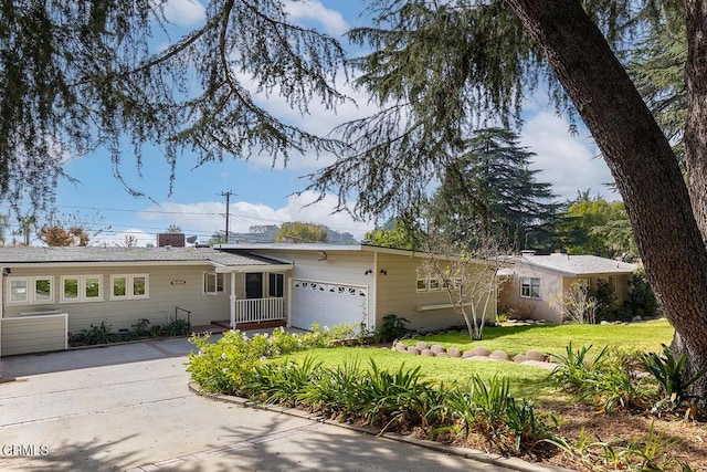 ranch-style home featuring a front yard and a garage