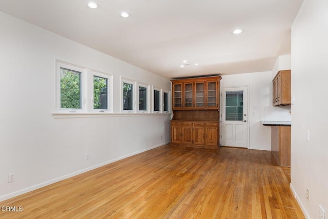 unfurnished living room featuring light hardwood / wood-style flooring