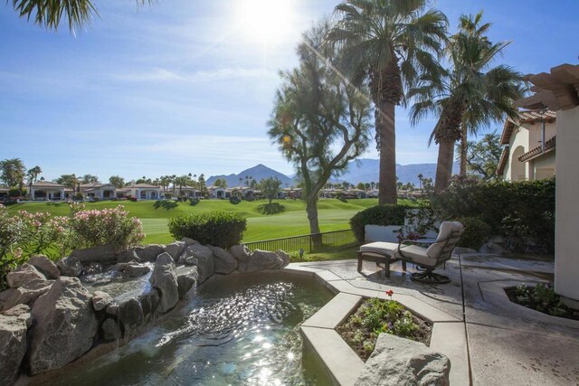 view of patio / terrace featuring a mountain view