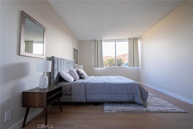 bedroom with hardwood / wood-style flooring