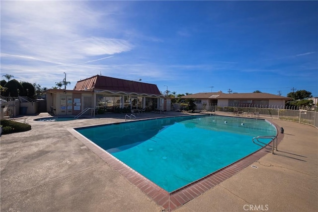 view of pool featuring a patio