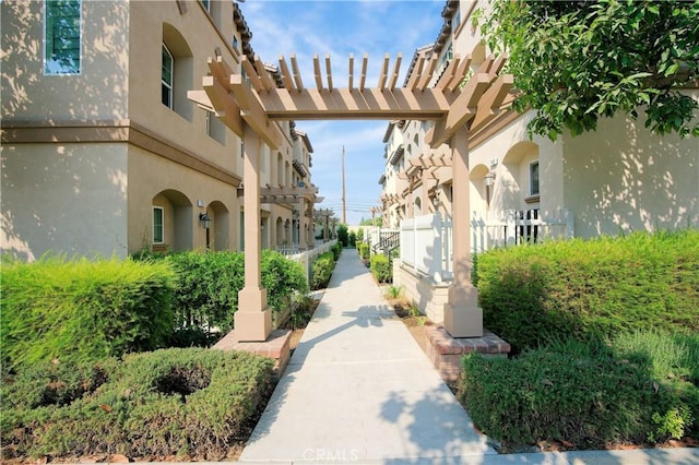 view of home's community featuring a pergola