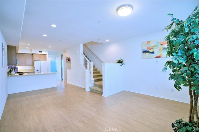 unfurnished living room featuring light wood-type flooring