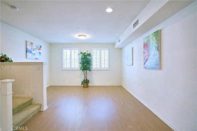 unfurnished room with light hardwood / wood-style flooring