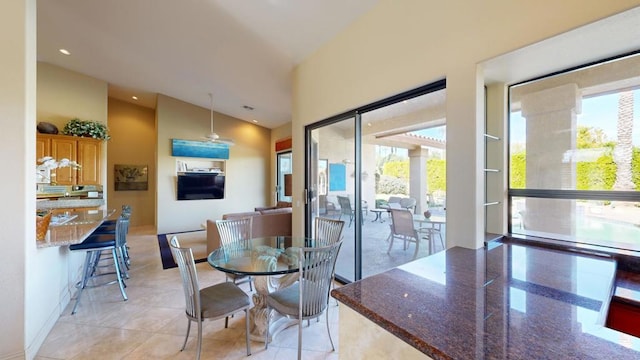 dining room featuring a towering ceiling