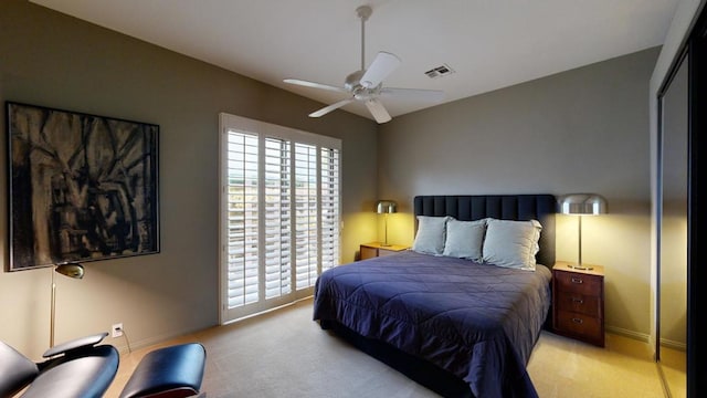 carpeted bedroom with ceiling fan