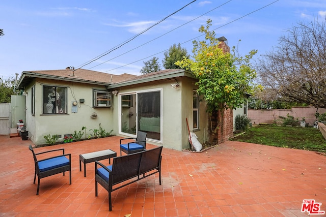 rear view of house with a patio