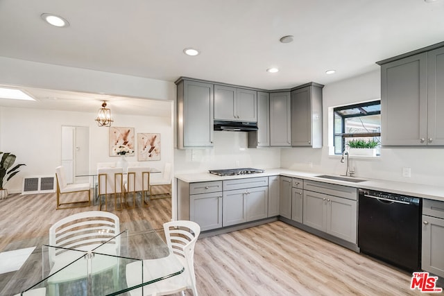 kitchen featuring sink, gray cabinets, black dishwasher, and light hardwood / wood-style flooring