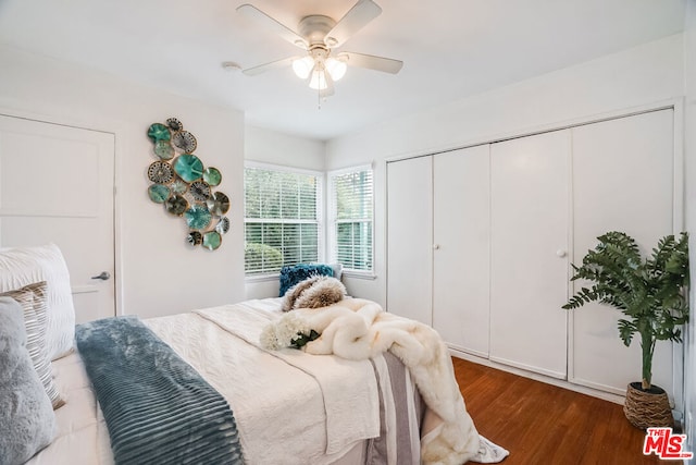 bedroom with ceiling fan and hardwood / wood-style flooring