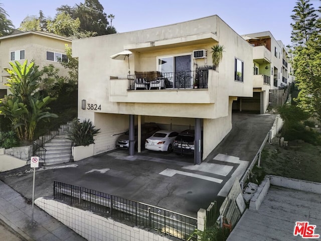 exterior space featuring a wall unit AC