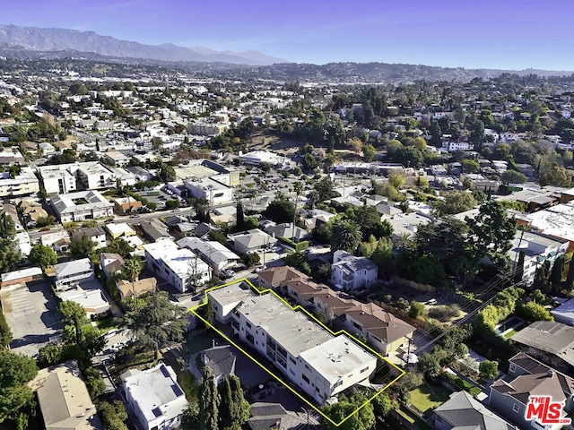 birds eye view of property with a mountain view