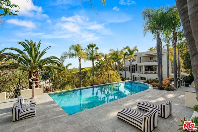 view of pool with a patio area